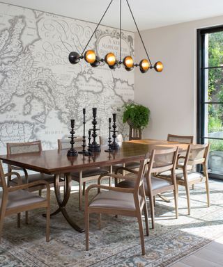 Dining room by Perfitt Richards Interiors with a map of the Roman Empire wall mural